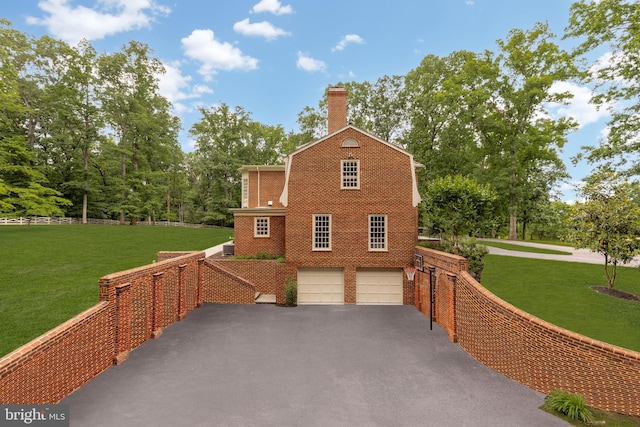 13300 Manor Stone Dr, Darnestown, MD 20874 - view of side of property with driveway, an attached garage, a chimney, and brick siding