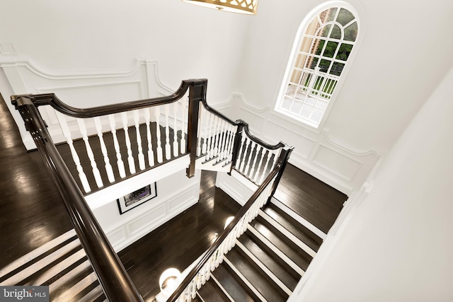 13300 Manor Stone Dr, Darnestown, MD 20874 - stairs with a decorative wall, wood finished floors, and wainscoting