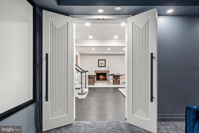 13300 Manor Stone Dr, Darnestown, MD 20874 - hallway with a raised ceiling, ornamental molding, wood finished floors, stairs, and recessed lighting