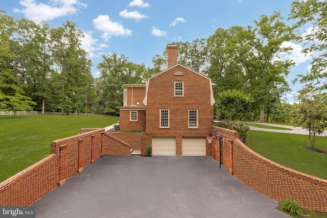 13300 Manor Stone Dr, Darnestown, MD 20874 - view of property exterior with driveway, a garage, a chimney, and brick siding