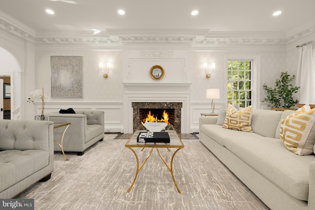 13300 Manor Stone Dr, Darnestown, MD 20874 - living room featuring crown molding, a decorative wall, a fireplace, recessed lighting, and wood finished floors