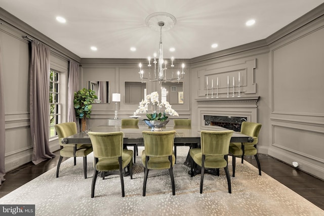 13300 Manor Stone Dr, Darnestown, MD 20874 - dining room with a decorative wall, a chandelier, wood finished floors, a fireplace, and recessed lighting