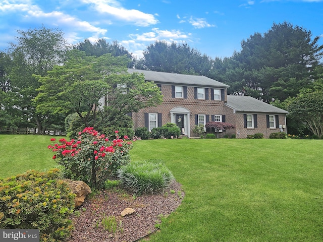 12 Pierson Dr, Hockessin, DE 19707 - colonial home featuring a front yard and brick siding