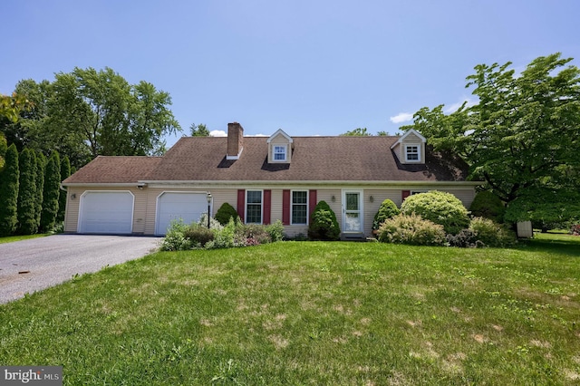 1549 Willoughby Cir, Manheim, PA 17545 - cape cod house with driveway, a front lawn, an attached garage, and a chimney
