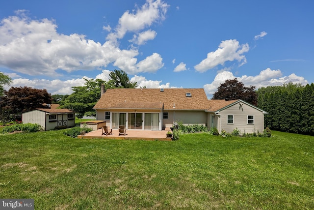 1549 Willoughby Cir, Manheim, PA 17545 - back of house featuring a storage unit, a sunroom, a lawn, a patio area, and a chimney