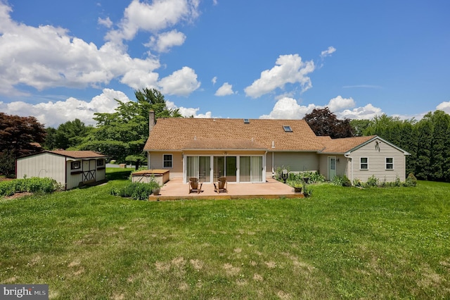 1549 Willoughby Cir, Manheim, PA 17545 - rear view of property featuring a jacuzzi, a patio area, a yard, a shed, and a chimney