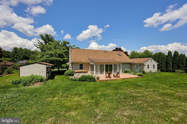 1549 Willoughby Cir, Manheim, PA 17545 - back of property featuring a sunroom, a patio, a chimney, and a lawn