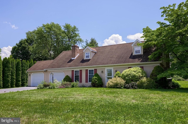 1549 Willoughby Cir, Manheim, PA 17545 - new england style home featuring an attached garage, driveway, a front yard, and a chimney