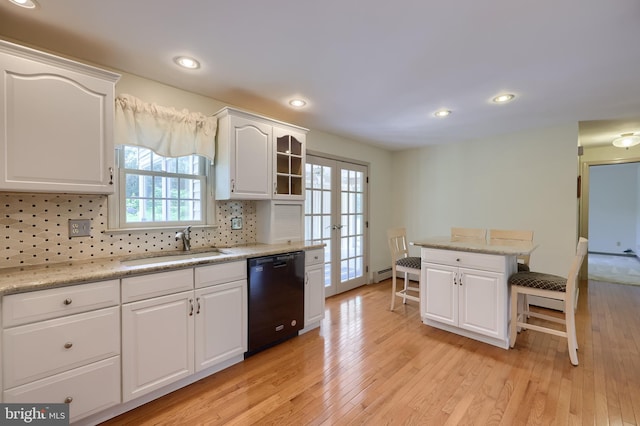 1549 Willoughby Cir, Manheim, PA 17545 - kitchen with dishwasher, a kitchen bar, light wood finished floors, healthy amount of natural light, and recessed lighting