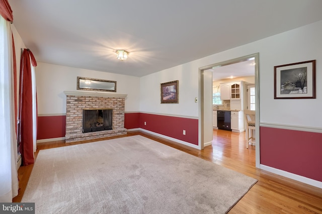 1549 Willoughby Cir, Manheim, PA 17545 - unfurnished living room featuring light wood-style flooring and a fireplace