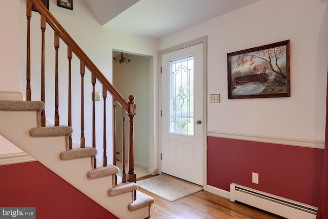 1549 Willoughby Cir, Manheim, PA 17545 - entrance foyer with a baseboard heating unit, wood finished floors, and stairway