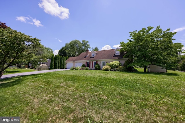 1549 Willoughby Cir, Manheim, PA 17545 - cape cod-style house with an attached garage, driveway, a shed, and a front yard