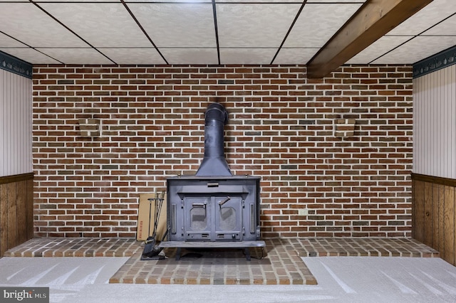 1549 Willoughby Cir, Manheim, PA 17545 - detailed view of wood walls, a wood stove, and brick wall