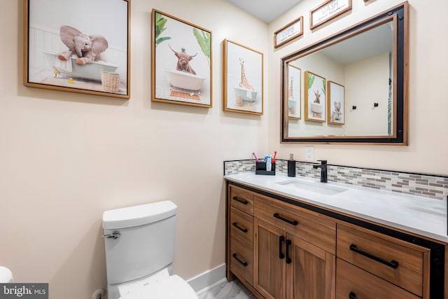 2997 Patapsco Rd, Finksburg, MD 21048 - half bathroom featuring toilet, vanity, tasteful backsplash, baseboards, and marble finish flooring