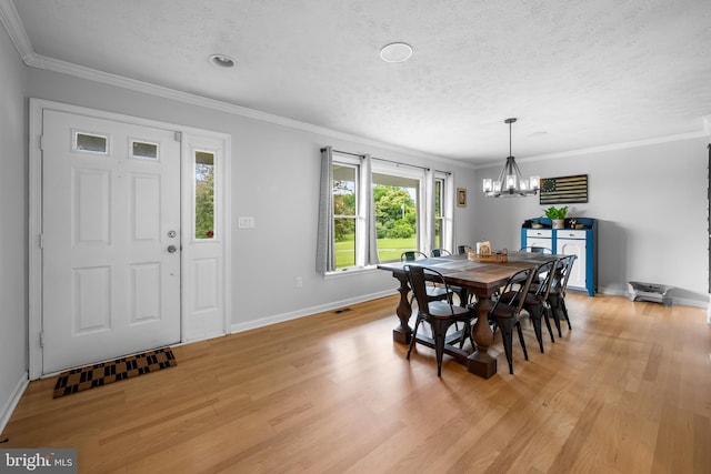 2997 Patapsco Rd, Finksburg, MD 21048 - dining room featuring a chandelier, light wood-type flooring, baseboards, crown molding, and a textured ceiling