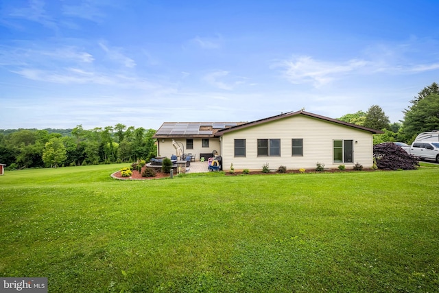 2997 Patapsco Rd, Finksburg, MD 21048 - back of house featuring solar panels, a lawn, and a patio area