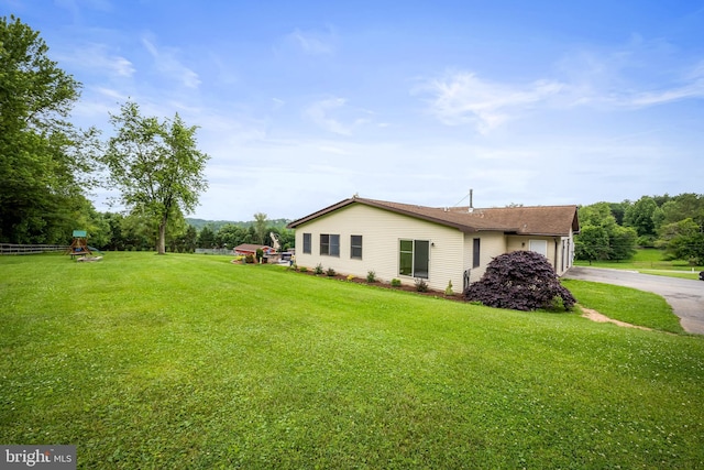 2997 Patapsco Rd, Finksburg, MD 21048 - view of side of property featuring driveway, a garage, a lawn, and a playground