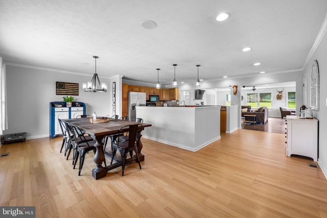 2997 Patapsco Rd, Finksburg, MD 21048 - dining area with light wood-type flooring, a chandelier, recessed lighting, ornamental molding, and baseboards