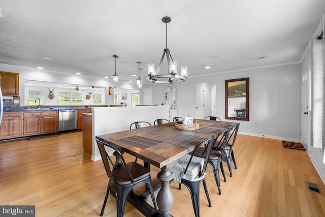 2997 Patapsco Rd, Finksburg, MD 21048 - dining area with a chandelier, light wood-type flooring, recessed lighting, crown molding, and baseboards