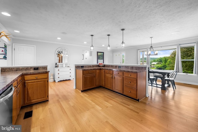 2997 Patapsco Rd, Finksburg, MD 21048 - kitchen with dark countertops, brown cabinets, dishwasher, light wood-type flooring, and crown molding