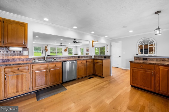 2997 Patapsco Rd, Finksburg, MD 21048 - kitchen featuring stainless steel dishwasher, a sink, light wood finished floors, brown cabinetry, and plenty of natural light