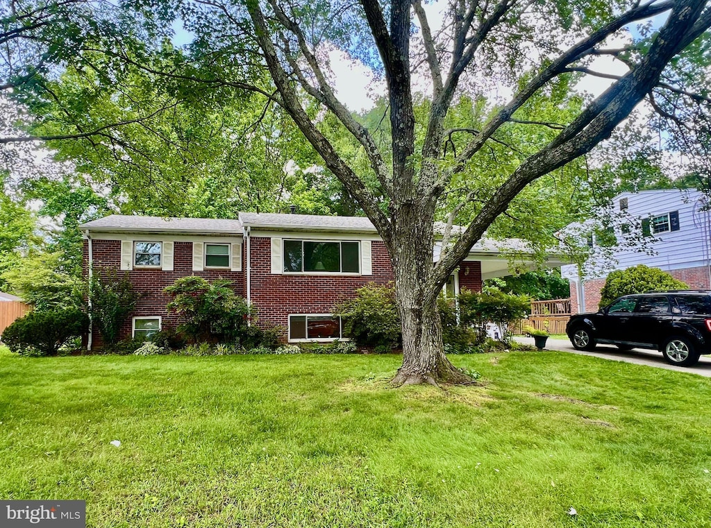 7018 96th Pl, Lanham, MD 20706 - view of front of property with brick siding and a front yard