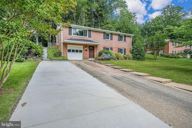 4721 Springbrook Dr, Annandale, VA 22003 - view of front facade with driveway, an attached garage, a front lawn, and brick siding