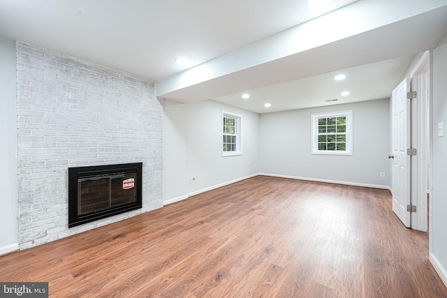 4721 Springbrook Dr, Annandale, VA 22003 - unfurnished living room with wood finished floors, a fireplace, recessed lighting, and healthy amount of natural light