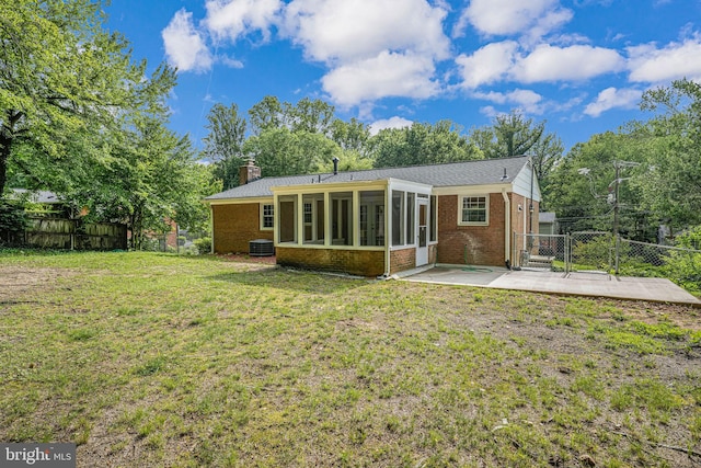 4721 Springbrook Dr, Annandale, VA 22003 - back of house featuring brick siding, a gate, a sunroom, and a fenced backyard
