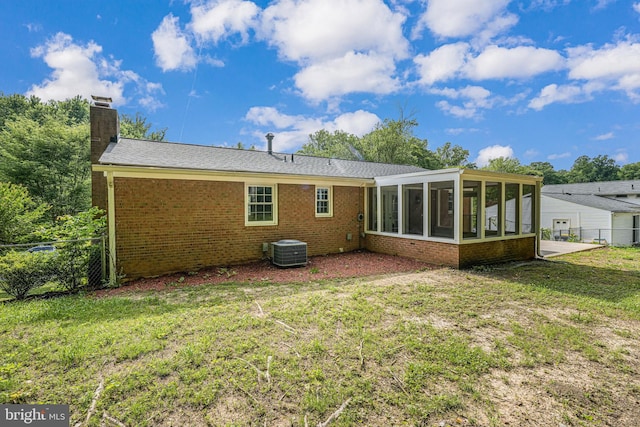 4721 Springbrook Dr, Annandale, VA 22003 - back of property featuring a sunroom, brick siding, and a chimney
