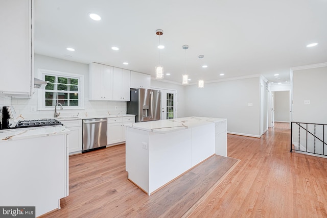 4721 Springbrook Dr, Annandale, VA 22003 - kitchen featuring appliances with stainless steel finishes, a center island, recessed lighting, backsplash, and white cabinetry