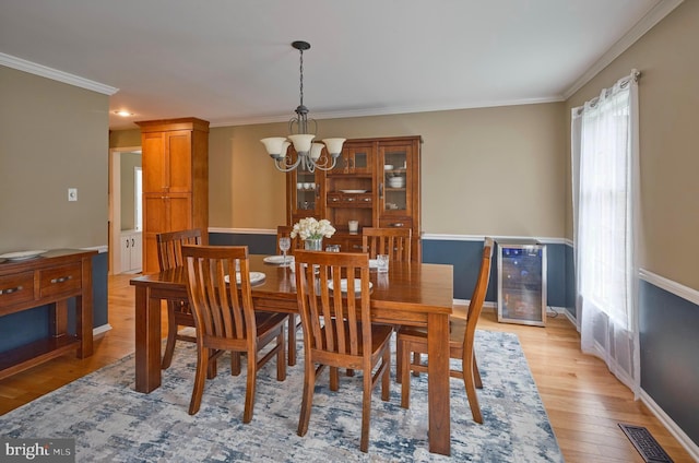 365 Newgate Rd, Langhorne, PA 19047 - dining area featuring a chandelier, crown molding, and light wood-type flooring