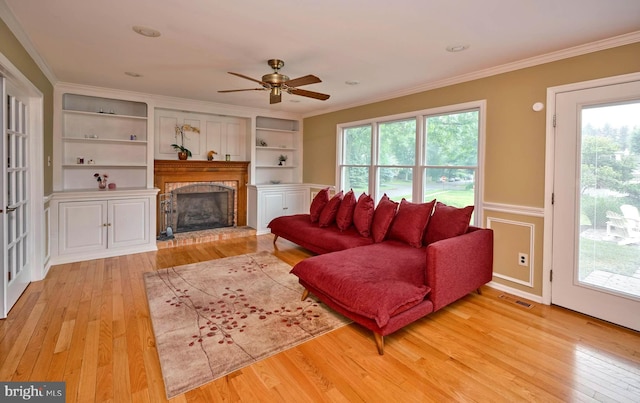 365 Newgate Rd, Langhorne, PA 19047 - living area with light wood-type flooring, crown molding, plenty of natural light, and a brick fireplace