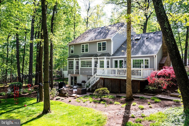 1399 Old Quincy Ln, Reston, VA 20194 - rear view of property with a deck, stairway, an outdoor fire pit, a shingled roof, and a lawn