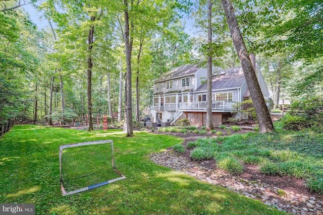 1399 Old Quincy Ln, Reston, VA 20194 - rear view of house with a wooden deck, stairs, and a lawn