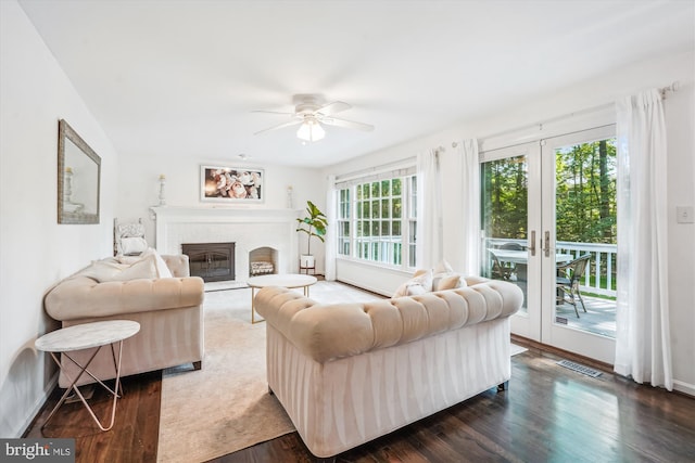 1399 Old Quincy Ln, Reston, VA 20194 - living area featuring dark wood-style floors, ceiling fan, and a fireplace