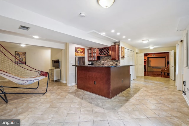 1399 Old Quincy Ln, Reston, VA 20194 - kitchen featuring freestanding refrigerator, tasteful backsplash, glass insert cabinets, light tile patterned floors, and recessed lighting