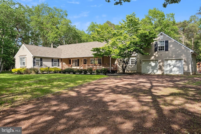 4 Steeplebush Trl, Southampton, NJ 08088 - view of front of house with covered porch, driveway, a garage, and a front yard