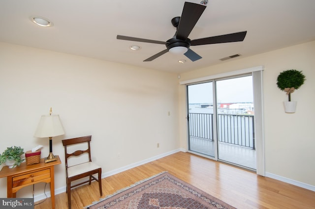 304 Academy St Unit 202, Cambridge, MD 21613 - living area featuring wood finished floors, ceiling fan, and recessed lighting