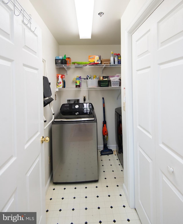 304 Academy St Unit 202, Cambridge, MD 21613 - washroom with separate washer and dryer and light floors