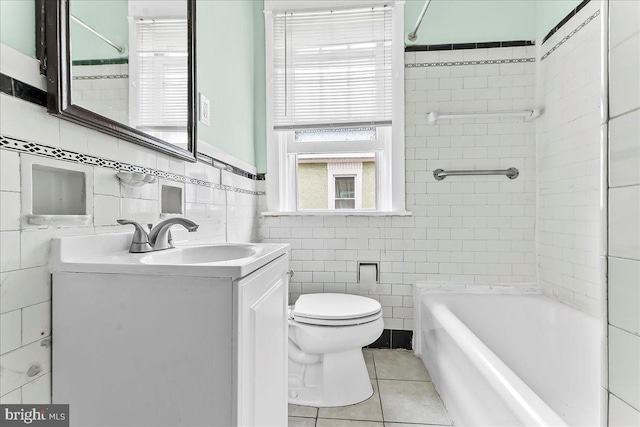 736 Poplar St, Sharon Hill, PA 19079 - full bathroom with tile walls, toilet, vanity, tile patterned flooring, and shower / bathtub combination