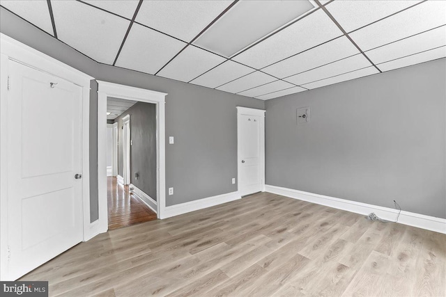 736 Poplar St, Sharon Hill, PA 19079 - empty room featuring light wood-type flooring, baseboards, and a drop ceiling