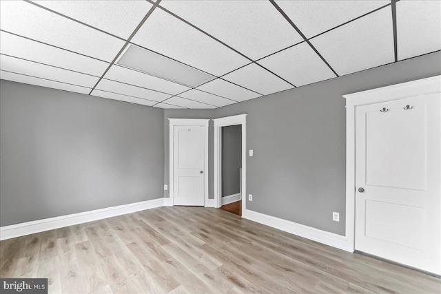 736 Poplar St, Sharon Hill, PA 19079 - unfurnished bedroom featuring baseboards, light wood-type flooring, and a drop ceiling