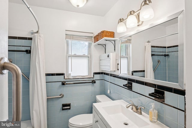 310 SW Dr, Silver Spring, MD 20901 - full bath featuring tile walls, vanity, and wainscoting