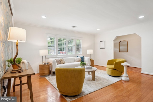 310 SW Dr, Silver Spring, MD 20901 - living room featuring ornamental molding, light wood-type flooring, arched walkways, and recessed lighting