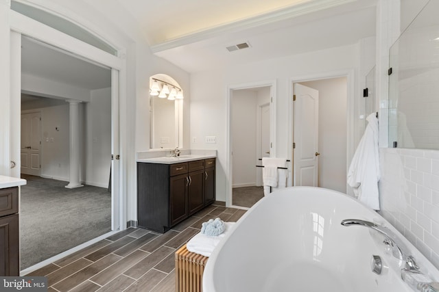 80 Shackelford Well Rd, Fredericksburg, VA 22406 - full bathroom with vanity, a soaking tub, ornate columns, wood tiled floors, and tiled shower