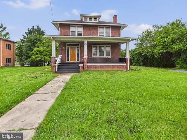 3437 Market St, Camp Hill, PA 17011 - american foursquare style home featuring brick siding, a front lawn, a porch, and a chimney
