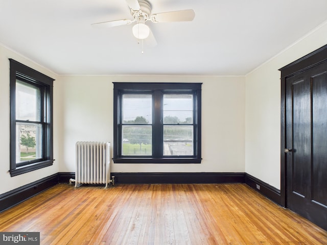 3437 Market St, Camp Hill, PA 17011 - spare room featuring radiator, light wood finished floors, a ceiling fan, and ornamental molding