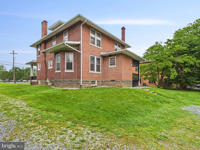 3437 Market St, Camp Hill, PA 17011 - view of property exterior with a chimney, brick siding, and a lawn