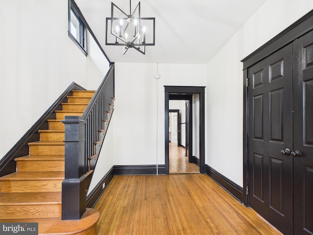 3437 Market St, Camp Hill, PA 17011 - foyer entrance featuring a chandelier, stairs, and wood finished floors